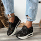 Blommigt mönstrade sneakers i broderad mesh